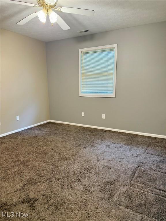 2518 Portage Grove Ct, Wooster, OH 44691 - empty room featuring baseboards, a ceiling fan, and carpet floors
