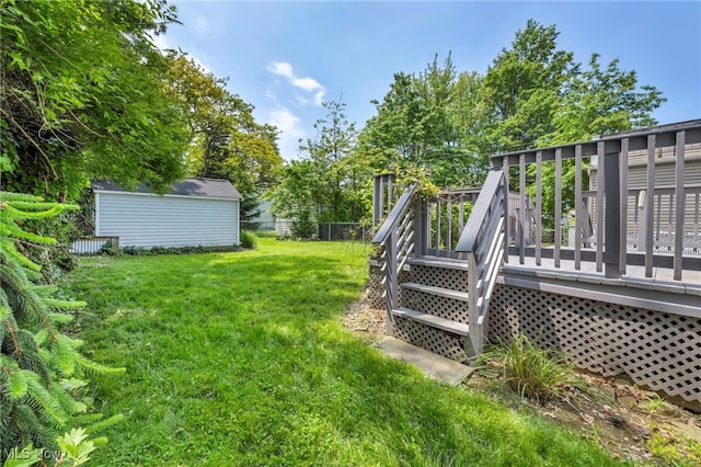 21650 Wilmore Ave, Euclid, OH 44123 - view of yard featuring a wooden deck and an outbuilding