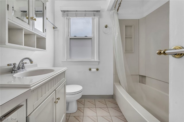 21650 Wilmore Ave, Euclid, OH 44123 - bathroom featuring vanity, toilet, shower / bathtub combination with curtain, and baseboards
