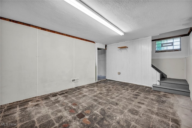 21650 Wilmore Ave, Euclid, OH 44123 - basement featuring a textured ceiling and stairway