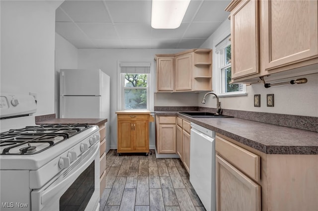 21650 Wilmore Ave, Euclid, OH 44123 - kitchen featuring white appliances, a sink, light brown cabinetry, a drop ceiling, and dark countertops