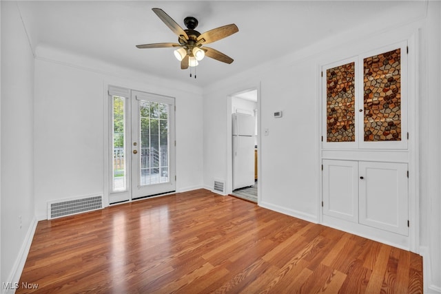 21650 Wilmore Ave, Euclid, OH 44123 - unfurnished room with ceiling fan, wood finished floors, and baseboards