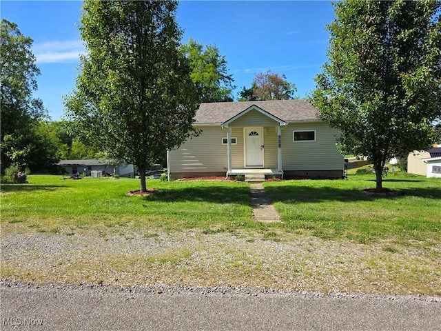 719 Clark St, Philo, OH 43771 - view of front of house featuring a front lawn and a shingled roof