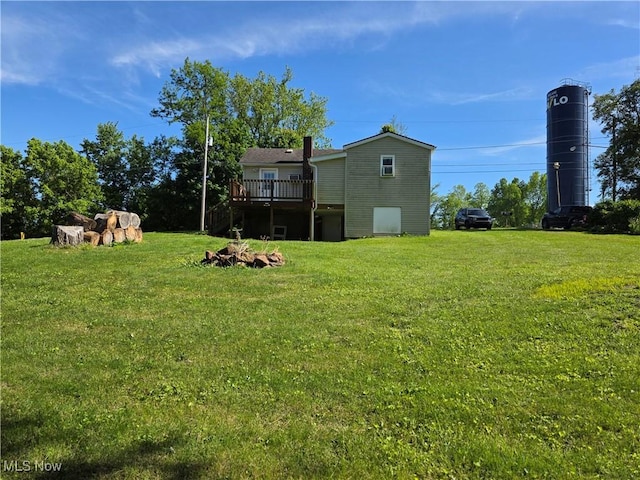 719 Clark St, Philo, OH 43771 - view of green lawn featuring a deck