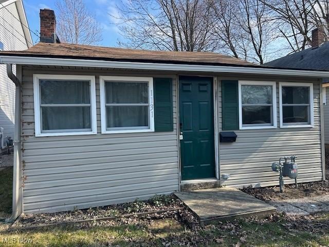 1131 Windermere Dr, Willoughby, OH 44094 - property entrance with a chimney