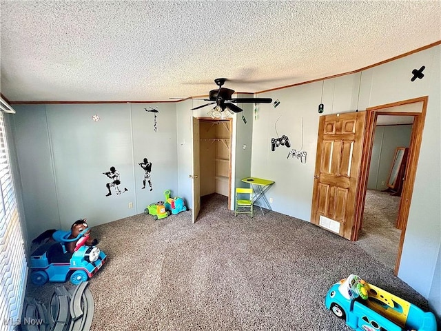 115 Rhodes Ave, Dillonvale, OH 43917 - playroom with ceiling fan, carpet floors, crown molding, and a textured ceiling