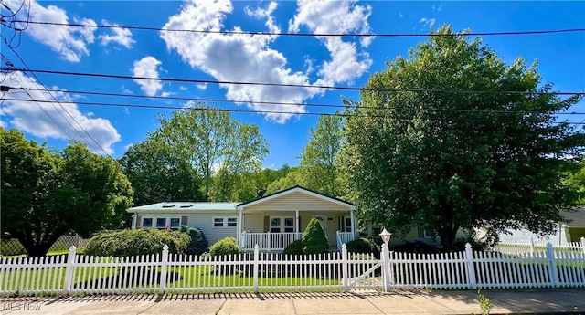 115 Rhodes Ave, Dillonvale, OH 43917 - view of front facade with a porch and a fenced front yard