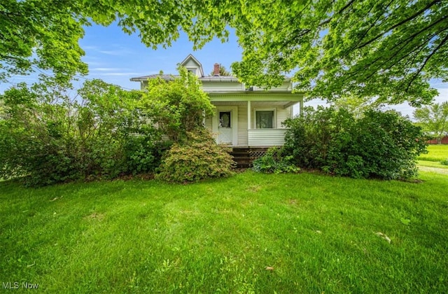 1092 State Route 46 N, Jefferson, OH 44047 - view of front of home with a porch and a front lawn