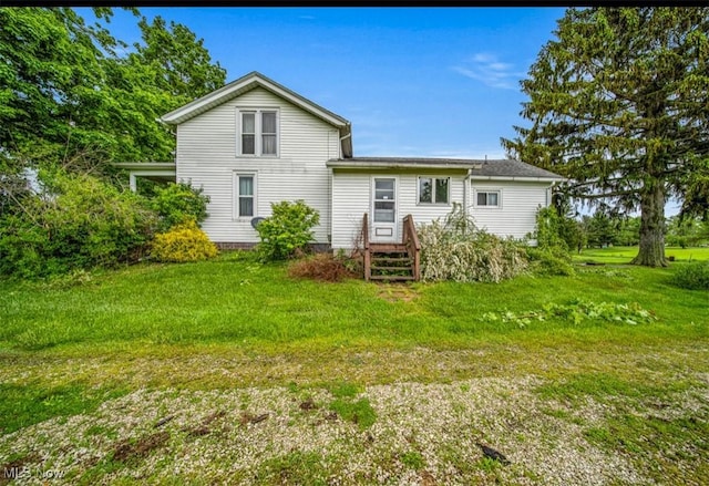 1092 State Route 46 N, Jefferson, OH 44047 - back of house with a lawn