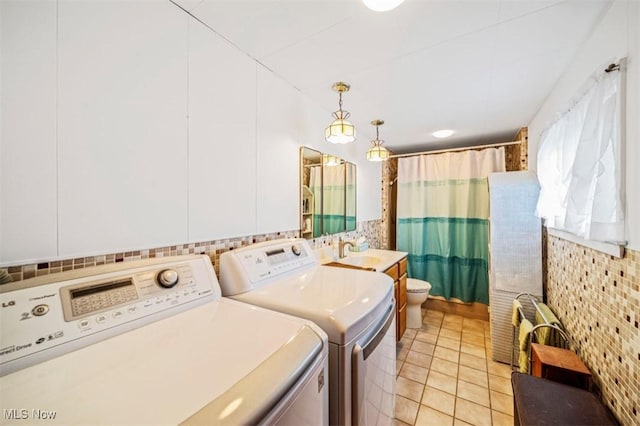 1092 State Route 46 N, Jefferson, OH 44047 - laundry area featuring independent washer and dryer and light tile patterned flooring