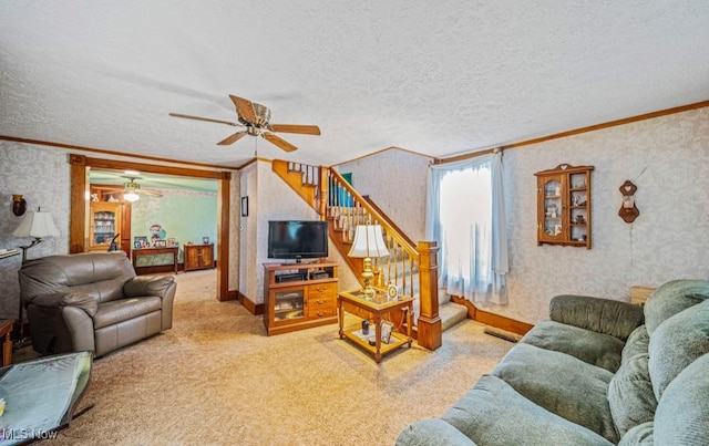 1092 State Route 46 N, Jefferson, OH 44047 - carpeted living room with crown molding, stairs, a ceiling fan, wallpapered walls, and a textured ceiling