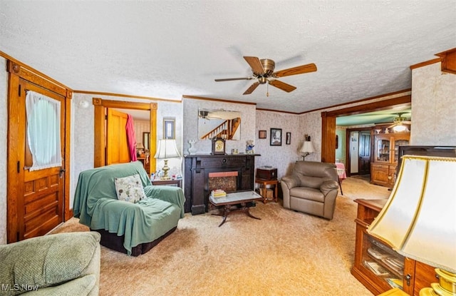 1092 State Route 46 N, Jefferson, OH 44047 - carpeted living area with ceiling fan, ornamental molding, a textured ceiling, and a fireplace