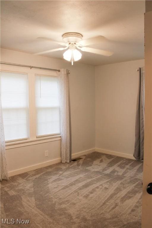504 Williams Ave, East Liverpool, OH 43920 - carpeted empty room featuring ceiling fan and baseboards