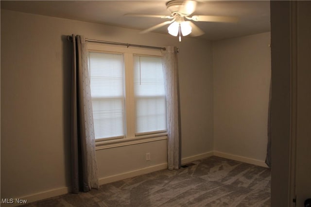 504 Williams Ave, East Liverpool, OH 43920 - empty room with a ceiling fan, dark carpet, and baseboards