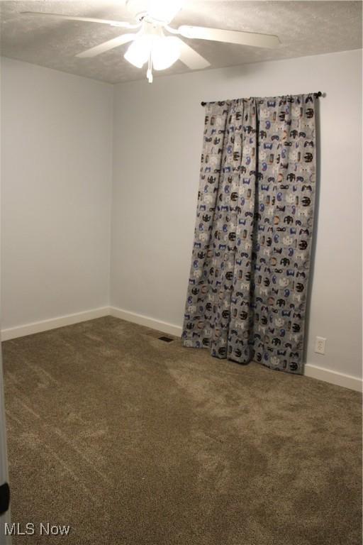 504 Williams Ave, East Liverpool, OH 43920 - carpeted spare room featuring a ceiling fan and baseboards