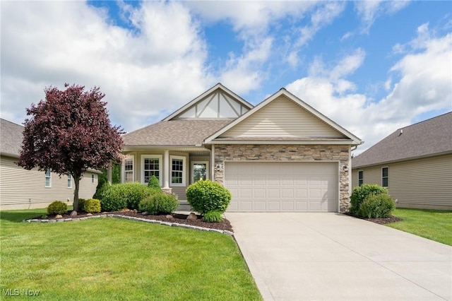 1147 Hunting Holw, Grafton, OH 44044 - view of front of property with an attached garage, a front lawn, driveway, and stone siding