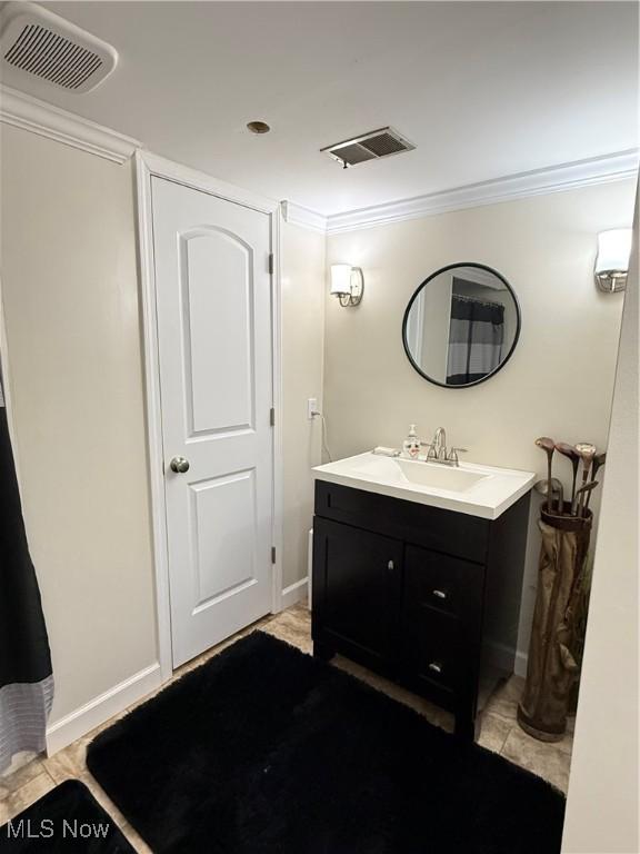 250 Crystal Ln, Weirton, WV 26062 - bathroom with vanity, ornamental molding, and baseboards