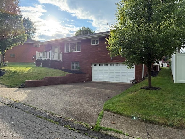 250 Crystal Ln, Weirton, WV 26062 - view of front of home with concrete driveway, a front lawn, a garage, and brick siding