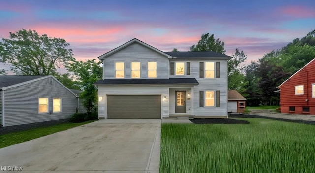 171 Henry, Bedford, OH 44146 - traditional-style home with a garage, driveway, and a front lawn