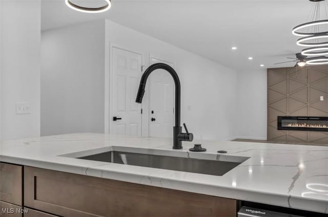 171 Henry, Bedford, OH 44146 - kitchen featuring a sink, ceiling fan, light stone counters, pendant lighting, and recessed lighting