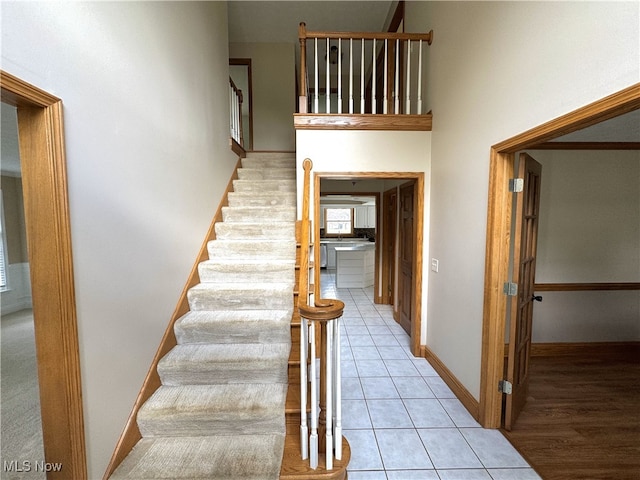2761 Timberline Dr, Cortland, OH 44410 - stairway featuring tile patterned flooring and baseboards