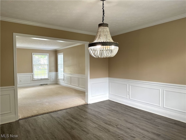 2761 Timberline Dr, Cortland, OH 44410 - unfurnished dining area with dark wood finished floors, a chandelier, ornamental molding, and wainscoting
