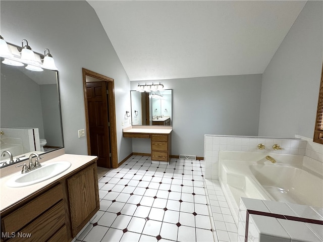 2761 Timberline Dr, Cortland, OH 44410 - bathroom featuring lofted ceiling, a bath, vanity, and tile patterned floors