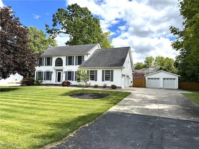 2761 Timberline Dr, Cortland, OH 44410 - colonial home featuring a detached garage and roof with shingles