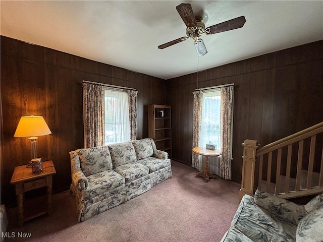 333 Heaslett Ave, Weirton, WV 26062 - living room with carpet flooring, ceiling fan, and wooden walls