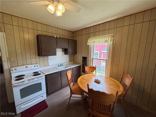 333 Heaslett Ave, Weirton, WV 26062 - kitchen featuring electric range, a sink, light countertops, dark brown cabinets, and a ceiling fan
