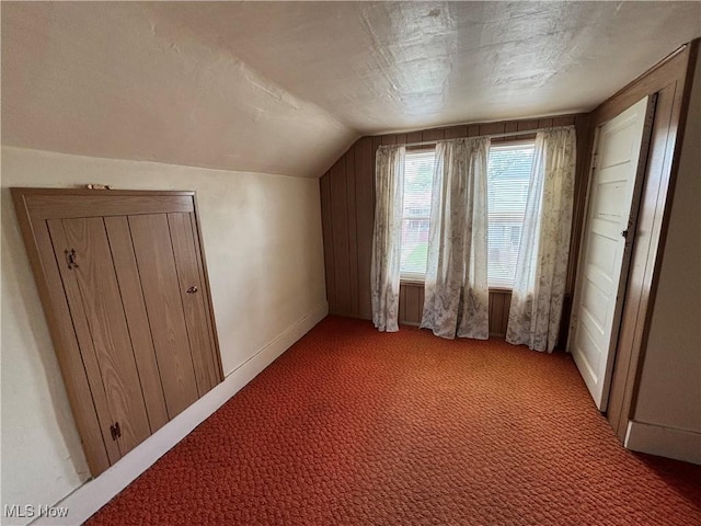 333 Heaslett Ave, Weirton, WV 26062 - additional living space with light colored carpet, lofted ceiling, and baseboards