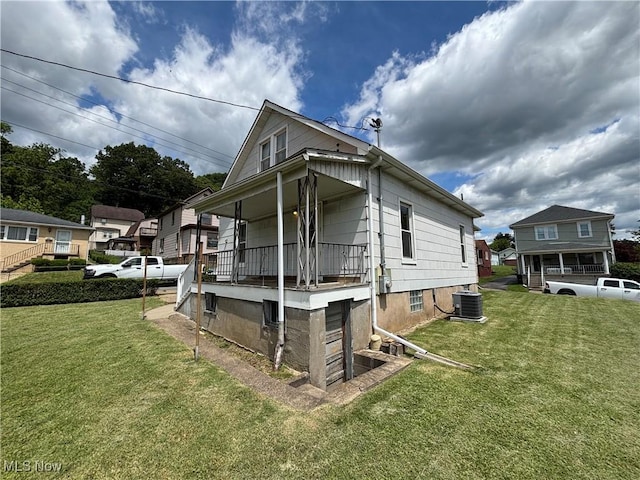 333 Heaslett Ave, Weirton, WV 26062 - back of property with a lawn, central AC, and a porch