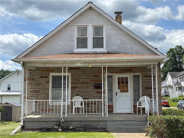 333 Heaslett Ave, Weirton, WV 26062 - view of front of home with a porch and a chimney