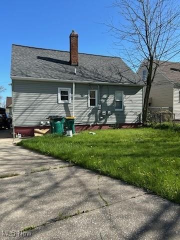 20806 Watson Rd, Maple Heights, OH 44137 - back of house featuring a chimney