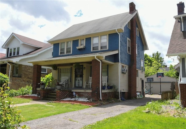 3308 Cedarbrook Rd, Cleveland Heights, OH 44118 - traditional style home with covered porch, a chimney, and a front lawn