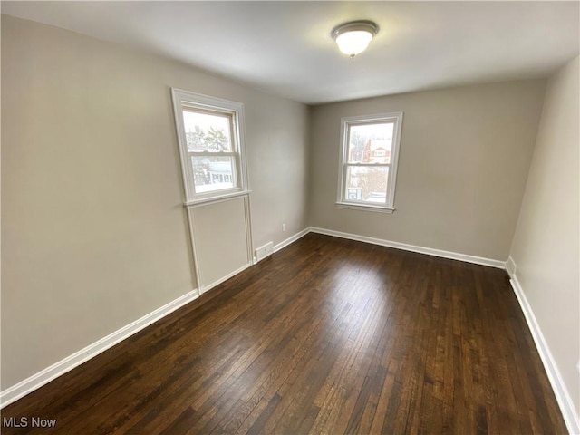 4485 Baintree Rd, University Heights, OH 44118 - empty room with dark wood-style flooring and baseboards