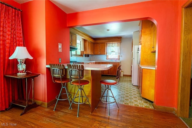 18288 Township Rd Unit 284, Coshocton, OH 43812 - kitchen featuring freestanding refrigerator, light countertops, and light wood-style flooring