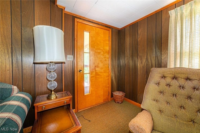 18288 Township Rd Unit 284, Coshocton, OH 43812 - living area with wooden walls, carpet, baseboards, and crown molding