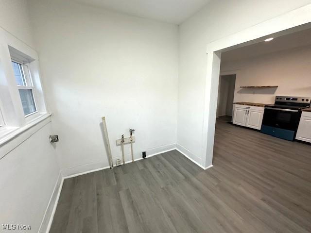 1264 Linden Ave, Zanesville, OH 43701 - washroom with dark wood-type flooring and baseboards
