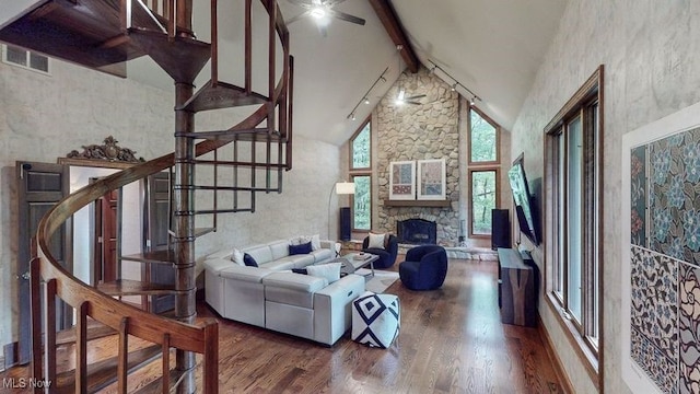 5360 Som Center Rd, Solon, OH 44139 - living area featuring a ceiling fan, beam ceiling, wood finished floors, stairway, and a stone fireplace