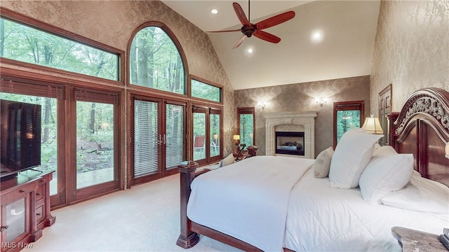 5360 Som Center Rd, Solon, OH 44139 - bedroom featuring high vaulted ceiling, light carpet, a fireplace, recessed lighting, and access to outside