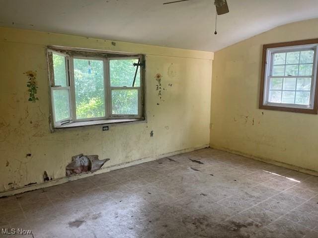 532 4th St SW, Massillon, OH 44647 - empty room featuring vaulted ceiling and ceiling fan