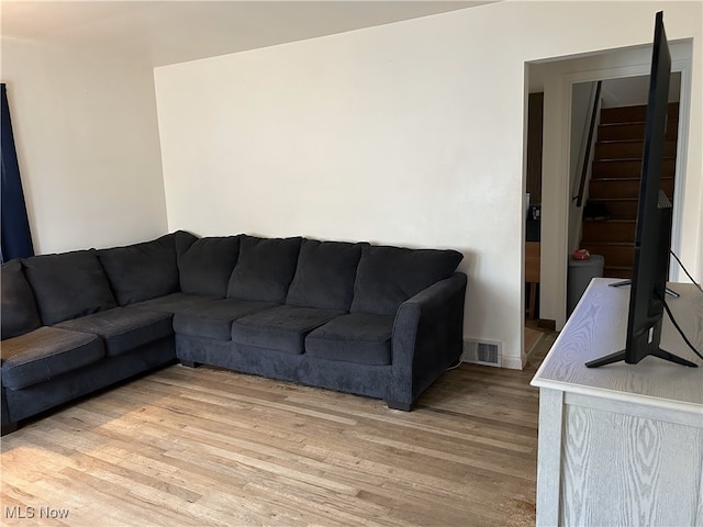 1214 Wentworth Ave, Toronto, OH 43964 - living room featuring light wood-type flooring, stairs, and baseboards