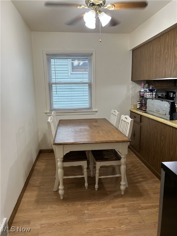 1214 Wentworth Ave, Toronto, OH 43964 - dining space with light wood-style flooring, ceiling fan, and baseboards