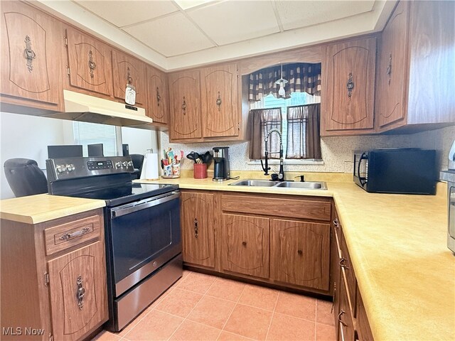 1214 Wentworth Ave, Toronto, OH 43964 - kitchen featuring electric range, black microwave, a sink, under cabinet range hood, and light countertops
