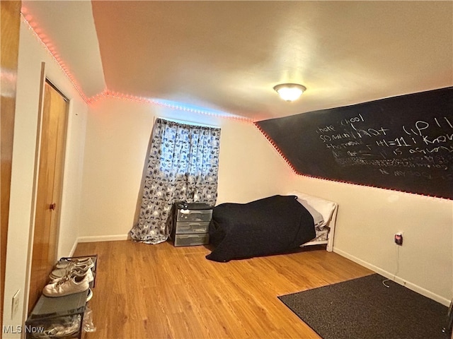 1214 Wentworth Ave, Toronto, OH 43964 - bedroom featuring lofted ceiling, wood finished floors, and baseboards