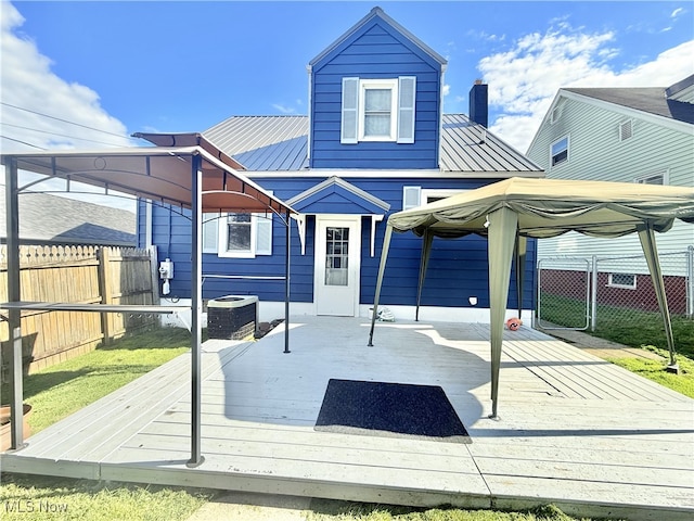 1214 Wentworth Ave, Toronto, OH 43964 - back of house with a deck, a chimney, metal roof, and cooling unit