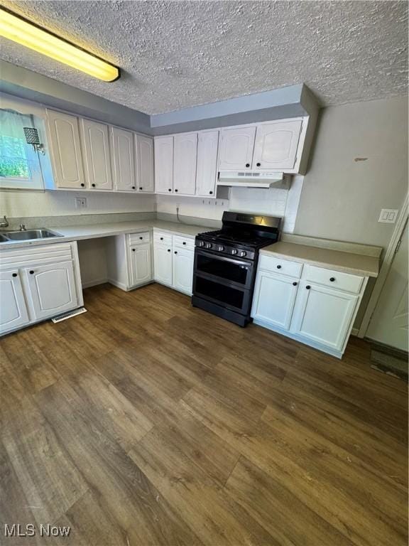 4940 State Route 26, Marietta, OH 45750 - kitchen featuring double oven range, under cabinet range hood, white cabinetry, light countertops, and dark wood finished floors