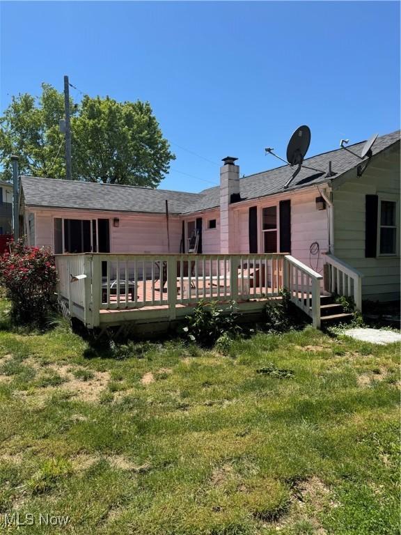 4940 State Route 26, Marietta, OH 45750 - rear view of house featuring a wooden deck, a yard, and a shingled roof