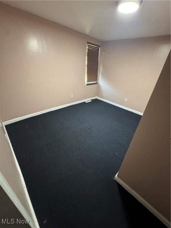 4940 State Route 26, Marietta, OH 45750 - carpeted empty room featuring baseboards